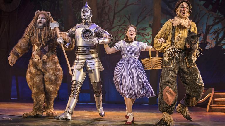 From left: Paul-Jordan Jansen, Carl Draper, Elizabeth Stenholt, Kyle Adams and Nessa (as Toto) in Paramount Theatre’s “The Wizard of Oz.” (Photo credit: Liz Lauren)