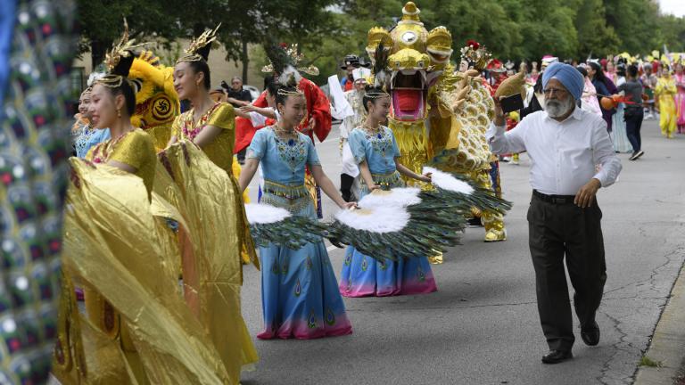 Members of the Tai Ji Men Qigong Academy perform during the Parliament of World Religion Parade of Faiths, Sunday, Aug. 13, 2023, in Chicago. (AP Photo / Paul Beaty)