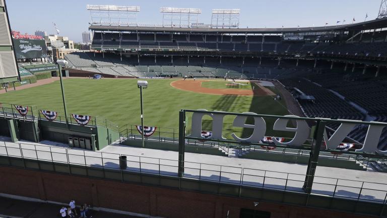 Wrigley Field is viewed from a nearby rooftop before an opening day baseball game between the Chicago Cubs and the Milwaukee Brewers in Chicago, Friday, July 24, 2020, in Chicago. (AP Photo / Nam Y. Huh)
