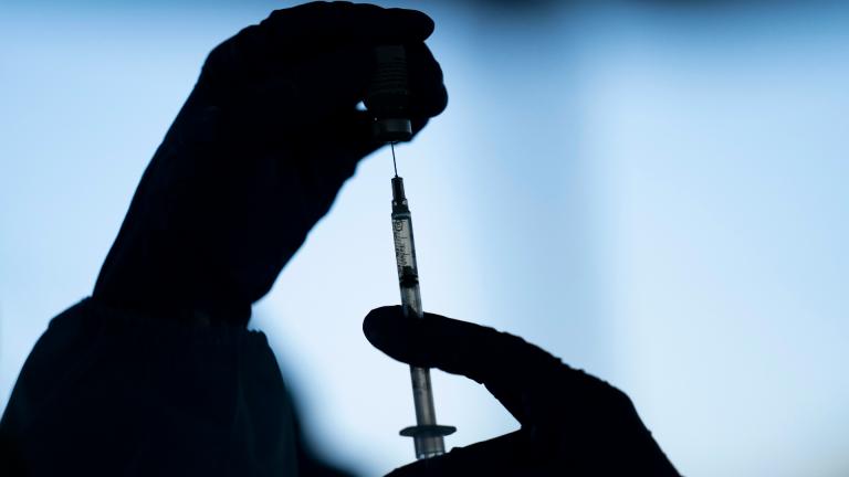 A medical staff member prepares the Pfizer-BioNTech COVID-19 vaccine at Tudor Ranch in Mecca, Calif. on Jan. 21, 2021 (AP Photo / Jae C. Hong, File)
