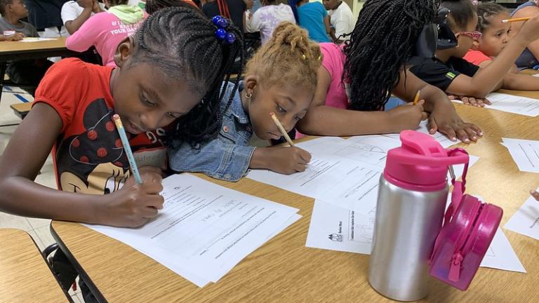 1st-8th grade YMCA summer program students at Cullen Elementary get creative at a Summer 2022 Spoken Word Field Trip workshop in Chicago's Roseland neighborhood. (Courtesy 826CHI)