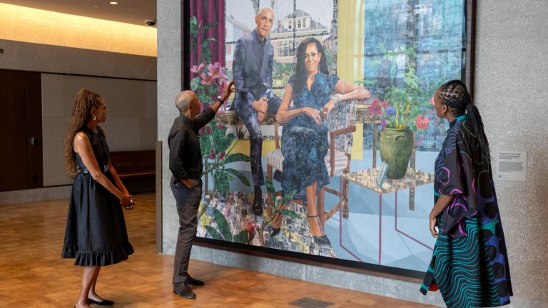 Former President Barack Obama and former first lady Michelle Obama view their portrait by artist Njideka Akunyili Crosby in the Obama Presidential Center Museum's Hope and Change Lobby on June 14, 2026. (Courtesy of The Obama Foundation)