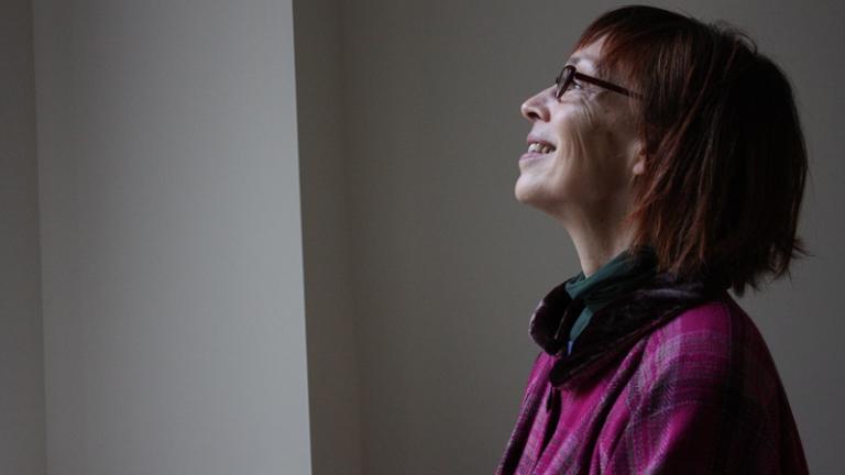 Artist Annie Markovich - the New Art Examiner's longtime managing editor - stands in the publication's former offices at 230 E. Ohio St.