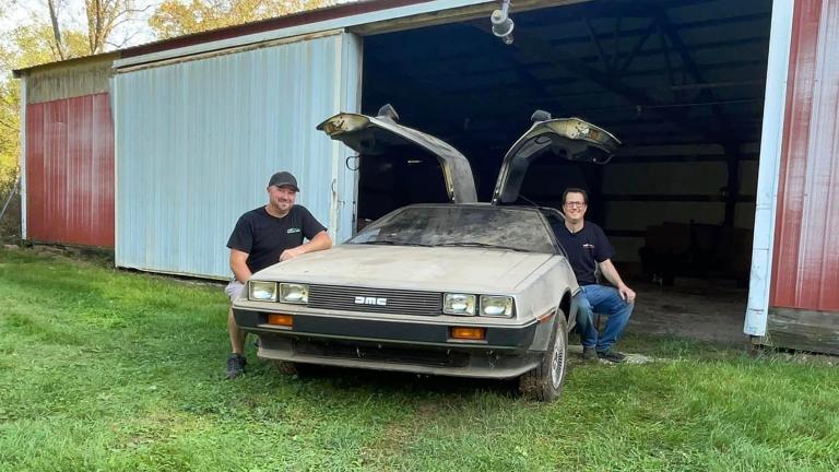 Kevin Thomas, left, and Michael McElhattan pose with the DeLorean in Wisconsin. (Courtesy of Mike McElhattan)