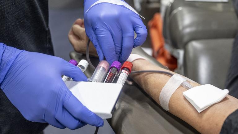  A nurse fills test tubes with blood to be tested during an American Red Cross bloodmobile in Fullerton, CA, in 2022. (Paul Bersebach / MediaNews Group / Orange County Register / Getty Images)