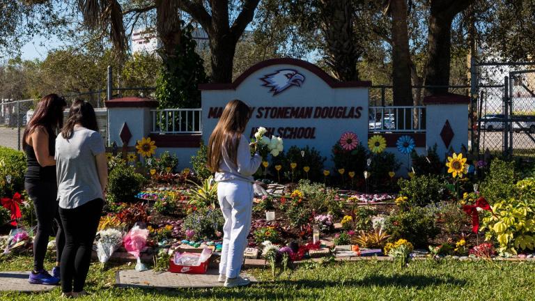 People visit a memorial at Marjory Stoneman Douglas High School to honor those killed on the 5th anniversary of the mass shooting on Feb. 14, 2023, in Parkland, Florida. (Saul Martinez / Getty Images / File)