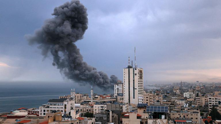 Smoke rises above buildings during an Israeli airstrike, in Gaza City on Oct. 9, 2023. (Mahmud Hams / AFP / Getty Images)