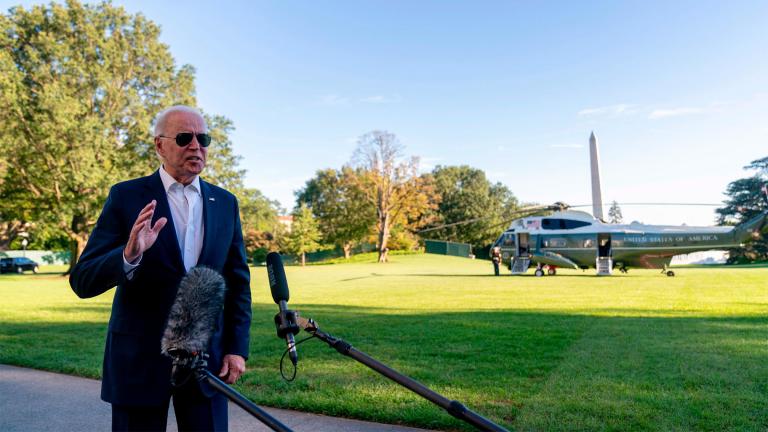 President  Biden speaks to members of the media as he arrives at the White House in Washington, on Sept. 26 after returning from a weekend at Camp David. (Andrew Harnik / AP)