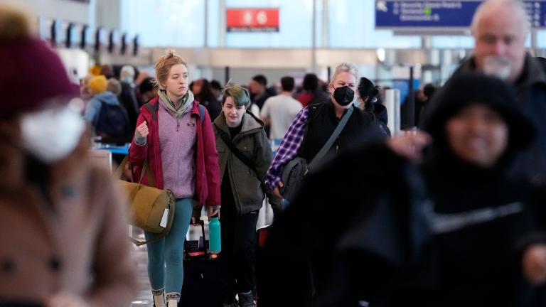 Travelers walk through Terminal 3 at O'Hare International Airport in Chicago. (Nam Y. Huh / AP)
