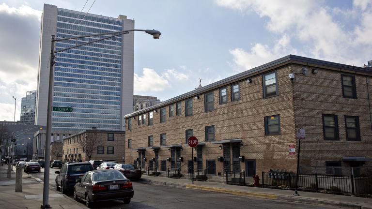 The Cabrini-Green rowhouses stand in front of a residential tower in Chicago in 2018. (Daniel Acker / Bloomberg / Getty Images)