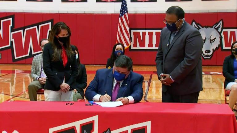 Illinois Gov. J.B. Prtizker signed the Teaching Equitable Asian American History Act on Friday, July 9, requiring public K-12 schools to teach Asian American history. (Pool via CNN)