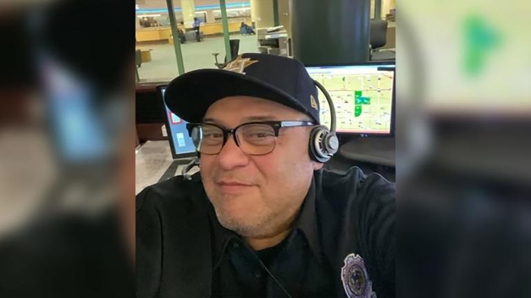 Guadalupe Lopez at the 911 dispatch center where he worked for more than 30 years. (Credit: Family photo)