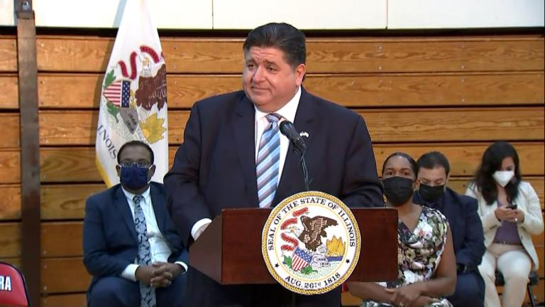 Gov. J.B. Pritzker on Aug. 2, 2021 signed new legislation expanding background checks on all gun sales in the state starting in 2024. (Pool photo)