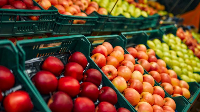 Apples are displayed in a grocery store. (Valerii Apetroaiei / iStock) 