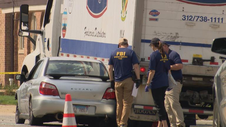 FBI investigators on the scene of a fatal ICE shooting in Frankin Park on Sept. 12, 2025. (WTTW News)