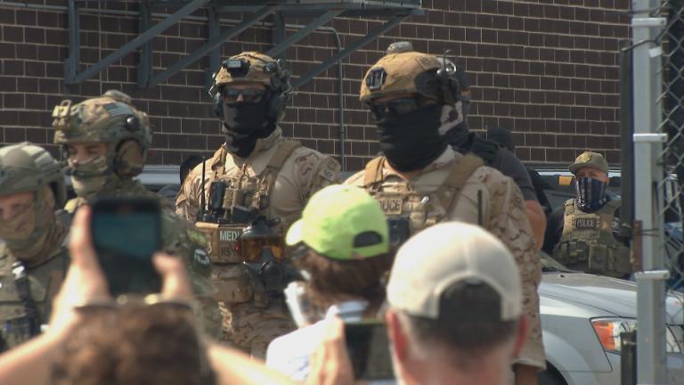 Federal agents appear outside an immigration processing center in Broadview, Ill. (WTTW News)