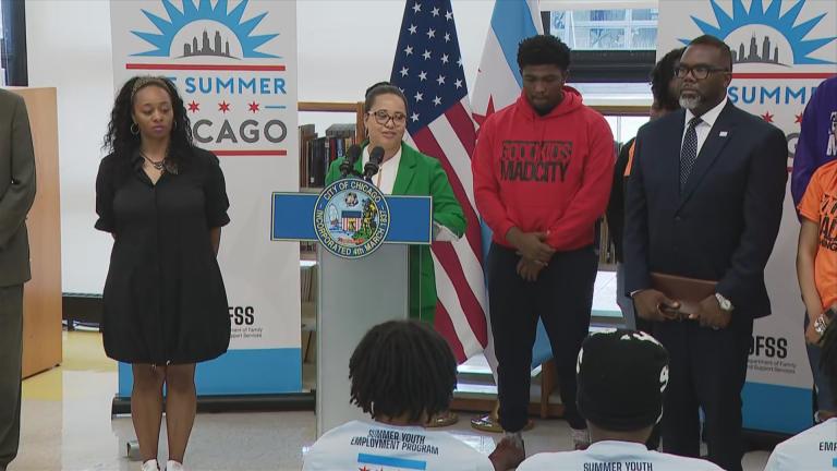 Brandie Knazze, commissioner of the Department of Family and Support Services, and Mayor Brandon Johnson announce an expansion of the One Summer Chicago program at Dyett High School on July 11, 2024. (WTTW News)