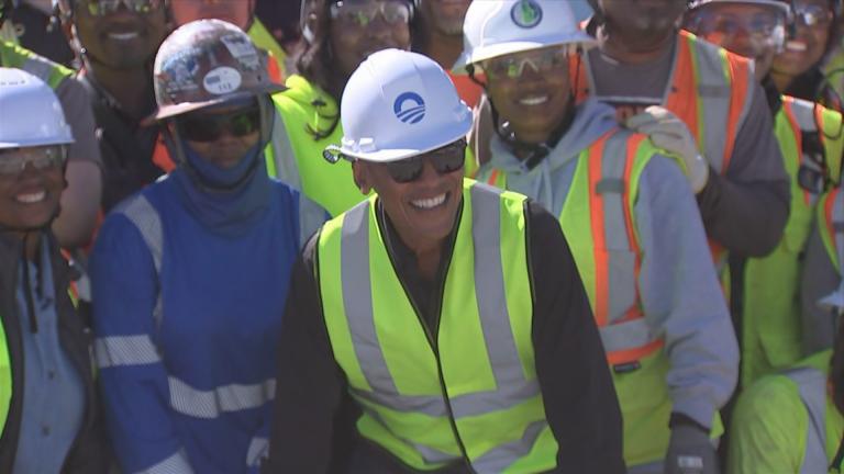 Former President Barack Obama posed for a photo with construction workers at the Obama Presidential Center construction site in Chicago on June 20, 2024. (WTTW News)
