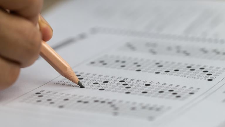 Student filling out a test in a file photo. (smolaw11 / iStock)