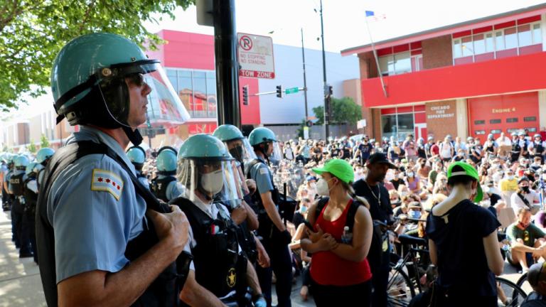 A line of Chicago police officers watch a demonstration at Division and Larrabee streets on June 2, 2020. (Evan Garcia / WTTW News)