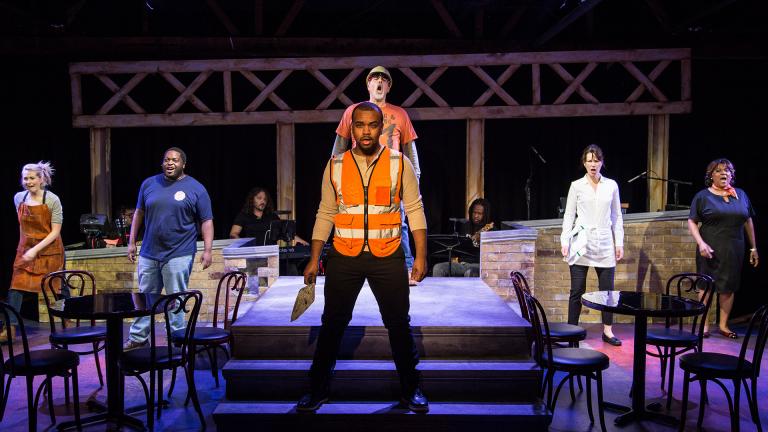 Kiersten Frumkin (left to right), Jared David Michael Grant, Stephen Blu Allen, Michael Kingston, Loretta Rezos and Cynthia F. Carter in “Working.” Background, in band are Perry Cowdery (left to right), Jeremy Ramey and Rafe Bradford. (Photo by Austin Oie Photography) 