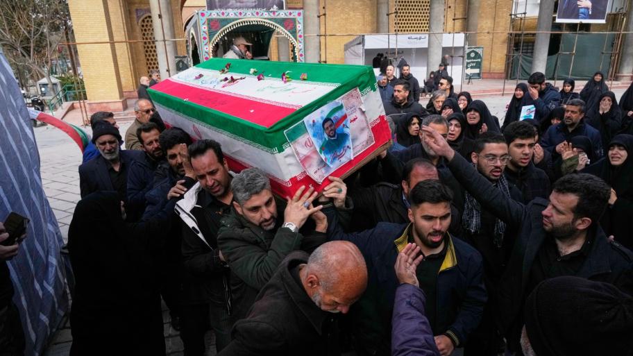 The coffin of Mehdi Hosseini, a man killed in a U.S.-Israeli strike, is carried for burial at Behesht-e Zahra cemetery in Tehran, Iran, Monday, March 9, 2026. (AP Photo / Vahid Salemi)