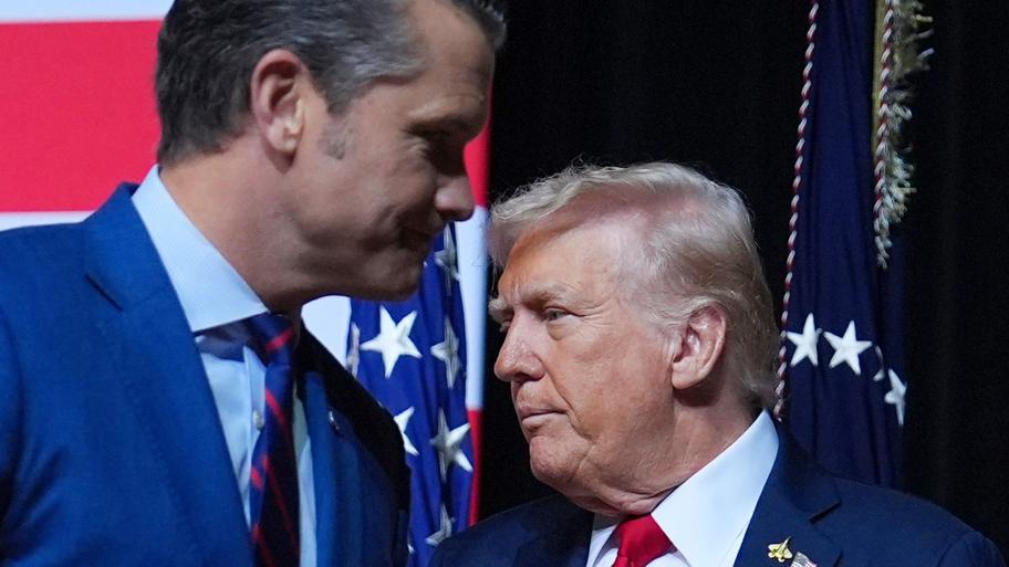 President Donald Trump is greeted by Secretary of Defense Pete Hegseth before speaking to a gathering of top U.S. military commanders at Marine Corps Base Quantico, Tuesday, Sept. 30, 2025, in Quantico, Va. (AP Photo / Evan Vucci)
