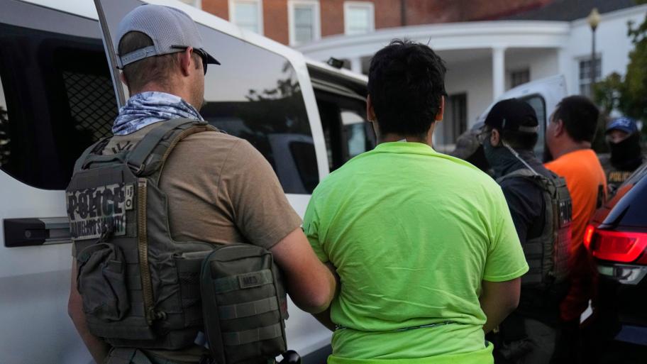 U.S. Immigration and Customs Enforcement agents make an arrest during an early morning operation in Park Ridge, Ill., Friday, Sept. 19, 2025. (AP Photo / Erin Hooley)