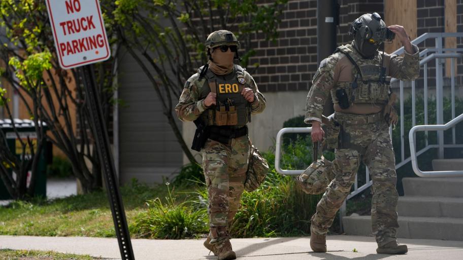 Enforcement and Removal Operations agents walk outside the U.S. Immigration and Customs Enforcement (ICE) building Wednesday, Sept. 24, 2025, in Broadview, Ill. (AP Photo/Erin Hooley)