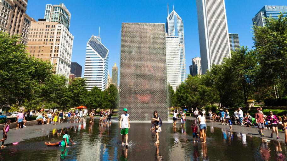 A file photo of people at the Crown Fountain in Millennium Park on a hot summer day. (RAUL RODRIGUEZ / iStock)