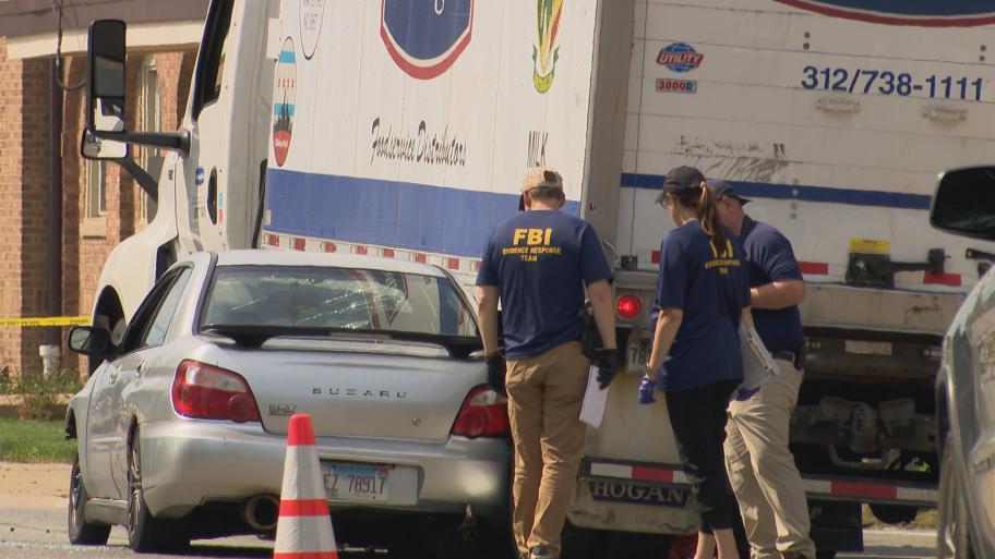 FBI investigators on the scene of a fatal ICE shooting in Frankin Park on Sept. 12, 2025. (WTTW News)