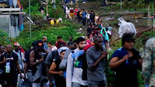 Migrants heading north line up to take a boat, in Bajo Chiquito, Darien province, Panama, Thursday, Oct. 5, 2023, after walking across the Darien Gap from Colombia. (Arnulfo Franco / AP Photo)
