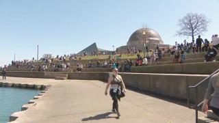 Hundreds of people gather at the Adler Planetarium to view the eclipse on April 8, 2024. (WTTW News)