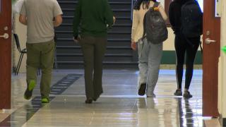 Students walk in CPS hallways. (WTTW News)