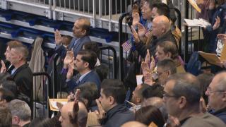 People at a naturalization ceremony. (WTTW News)