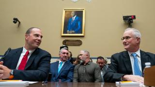 U.S. Air Force (Ret.) Maj. David Grusch, left, and U.S. Navy (Ret.) Cmdr. David Fravor, speak prior to a House Oversight and Accountability subcommittee hearing on UFOs, Wednesday, July 26, 2023, on Capitol Hill in Washington. (Nathan Howard / AP Photo)