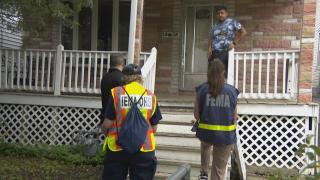 IEMA and FEMA workers assess flood damage on the West Side. (WTTW News)