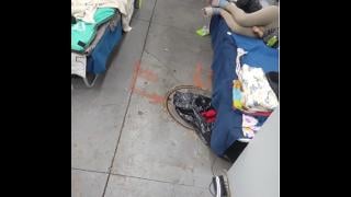 A photo submitted to WTTW News shows a sewer cover next to beds at a migrant facility in Pilsen. (Submitted photo)