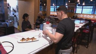 A restaurant worker is pictured in a file photo. (WTTW News)