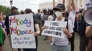 Demonstrators protest about abortion outside the Supreme Court in Washington, Friday, June 24, 2022. (CNN via WTTW News)