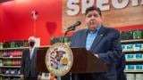 Gov. JB Pritzker speaks at a Springfield grocery store in 2022 in favor of temporarily eliminating the state’s grocery tax. Four years later, the tax will end permanently, at least statewide. (Jerry Nowicki / Capitol News Illinois)