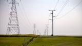 Power lines carry electricity over fields near Glasford. (Andrew Adams / Capitol News Illinois) 