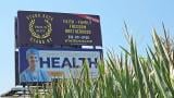 A billboard promoting the Proud Boys, a right-wing extremist group, appears in a cornfield in Clinton County, Illinois. (Molly Parker / Capitol News Illinois)