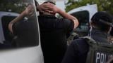 U.S. Immigration and Customs Enforcement agents make an arrest during an early morning operation in Park Ridge, Ill., Friday, Sept. 19, 2025. (AP Photo / Erin Hooley)