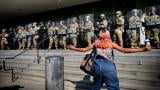 A protester taunts a line of California National Guard protecting a federal building in downtown Los Angeles on Monday, June 9, 2025. (AP Photo/Eric Thayer)