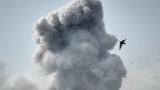 A bird flies by a plume of smoke rising after a strike in Tehran, Iran, Monday, March 2, 2026. (AP Photo/Vahid Salemi)