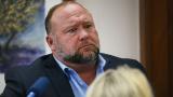 Conspiracy theorist Alex Jones attempts to answer questions about his emails asked by Mark Bankston, lawyer for Neil Heslin and Scarlett Lewis, during trial at the Travis County Courthouse in Austin, Wednesday Aug. 3, 2022. (Briana Sanchez / Austin American-Statesman via AP, Pool)