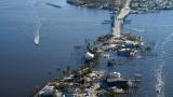 The bridge leading from Fort Myers to Pine Island, Fla., is heavily damaged in the aftermath of Hurricane Ian, Saturday, Oct. 1, 2022. Due to the damage, the island can only be reached by boat or air. (AP Photo/  Gerald Herbert)