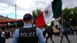 Police watch during the 2025 Pilsen Mexican Independence Day parade Saturday, Sept. 6, 2025, in Chicago. (AP Photo / Carolyn Kaster)