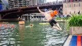 A participant enters the water during the 2025 Chicago River Swim. The Big Jump has been added to the 2026 event for folks prepared to take the plunge but not go the distance. (Linda Barrett / Chicago River Swim)